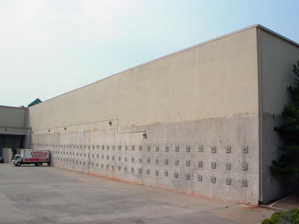 Larger commercial retaining wall with helical tieback anchors