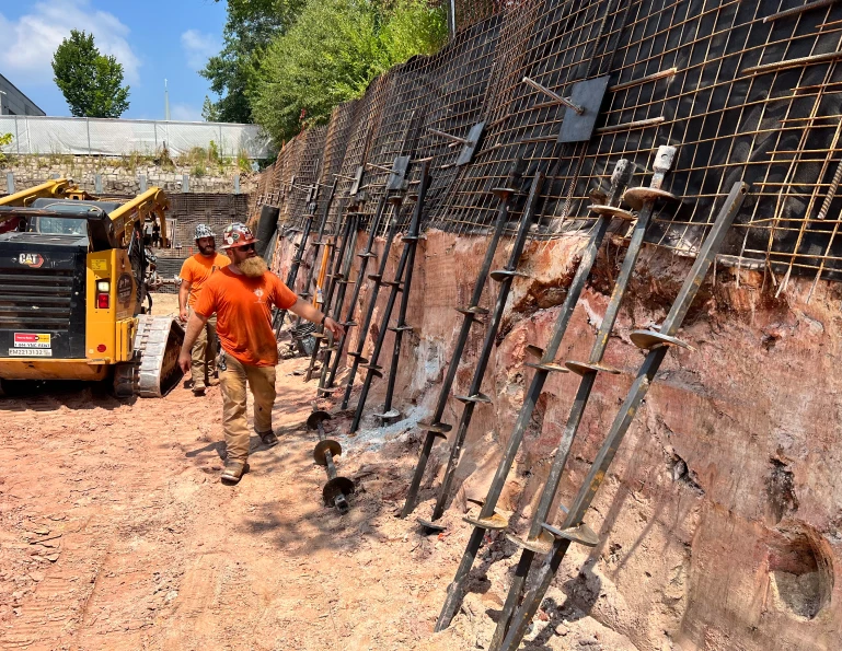 men working on foundation supports