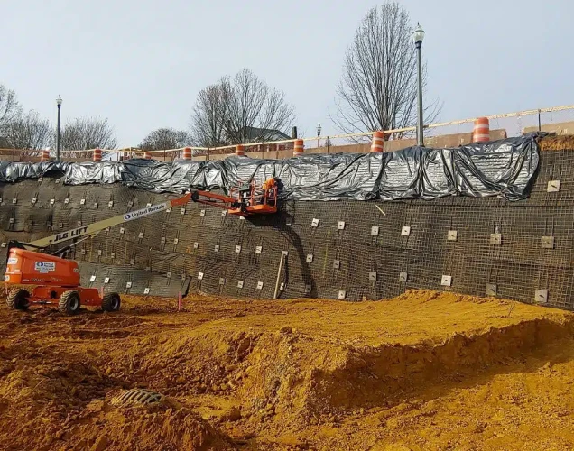 JLG Lift working to install several hundred tieback anchors on a commercial project