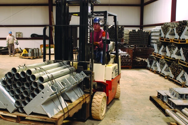 man driving piers on forklift